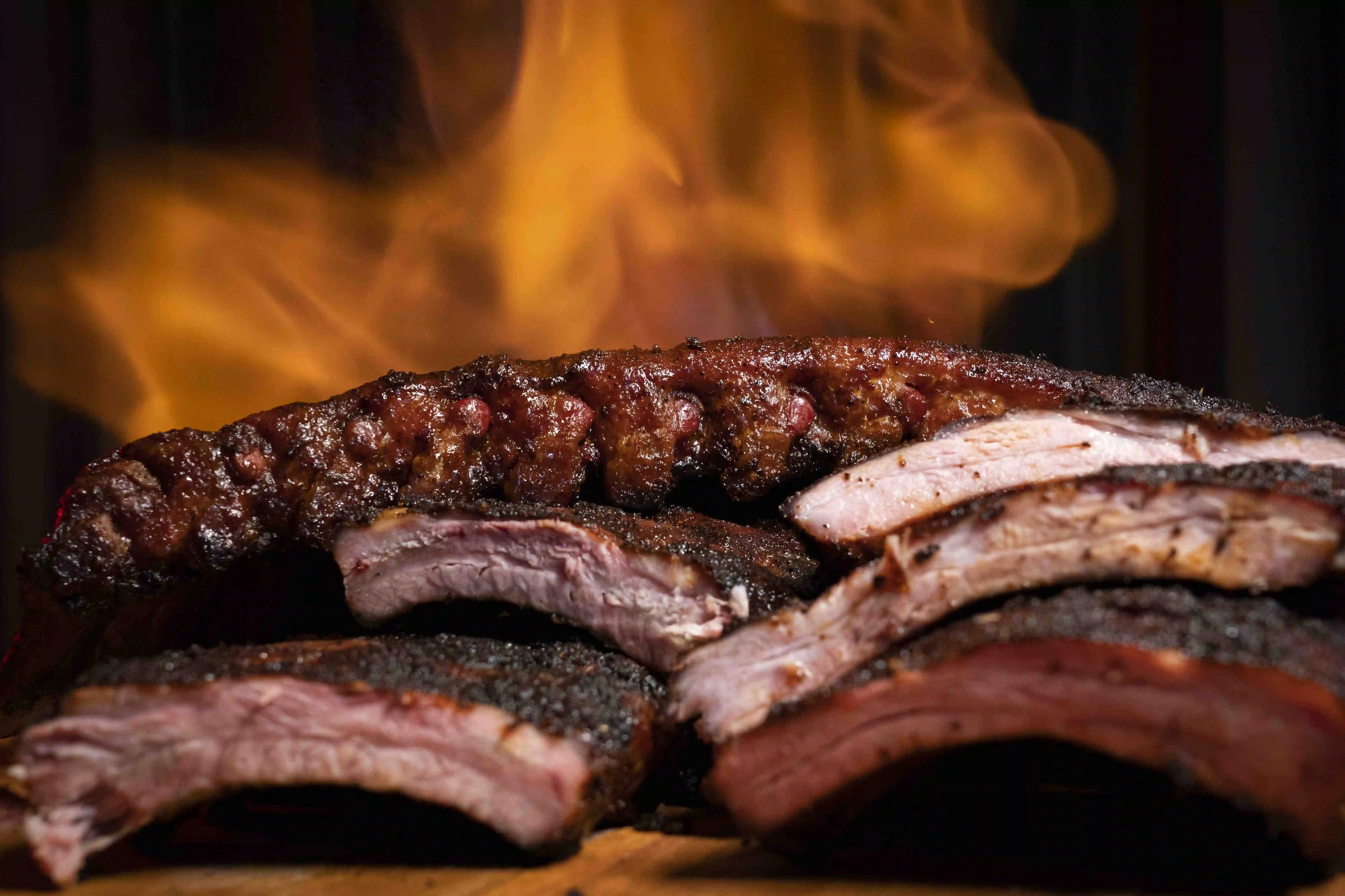 Smoked ribs over open flame at The Tonk Chicago